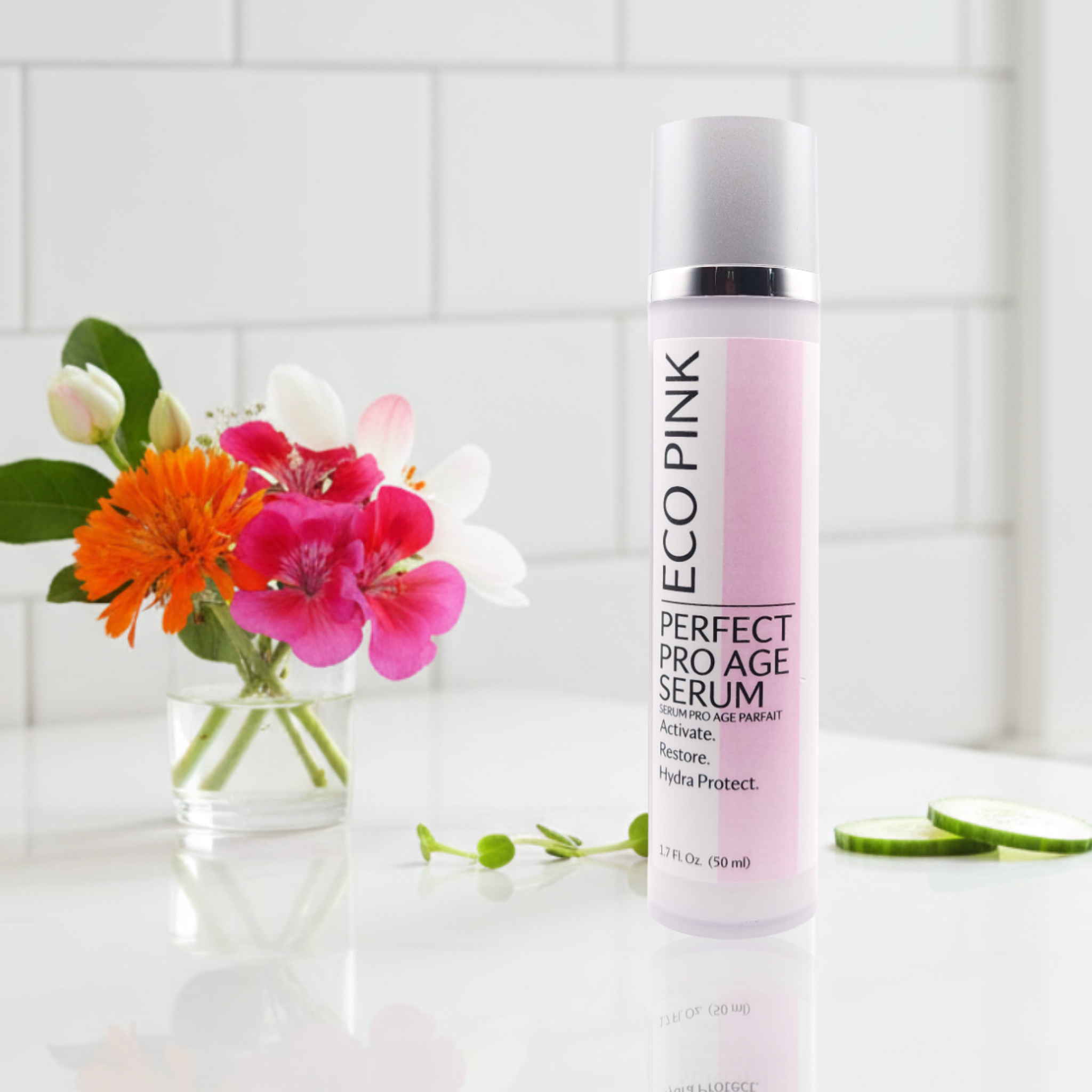 Ecopink Perfect Pro Age Serum bottle with flowers on a white surface