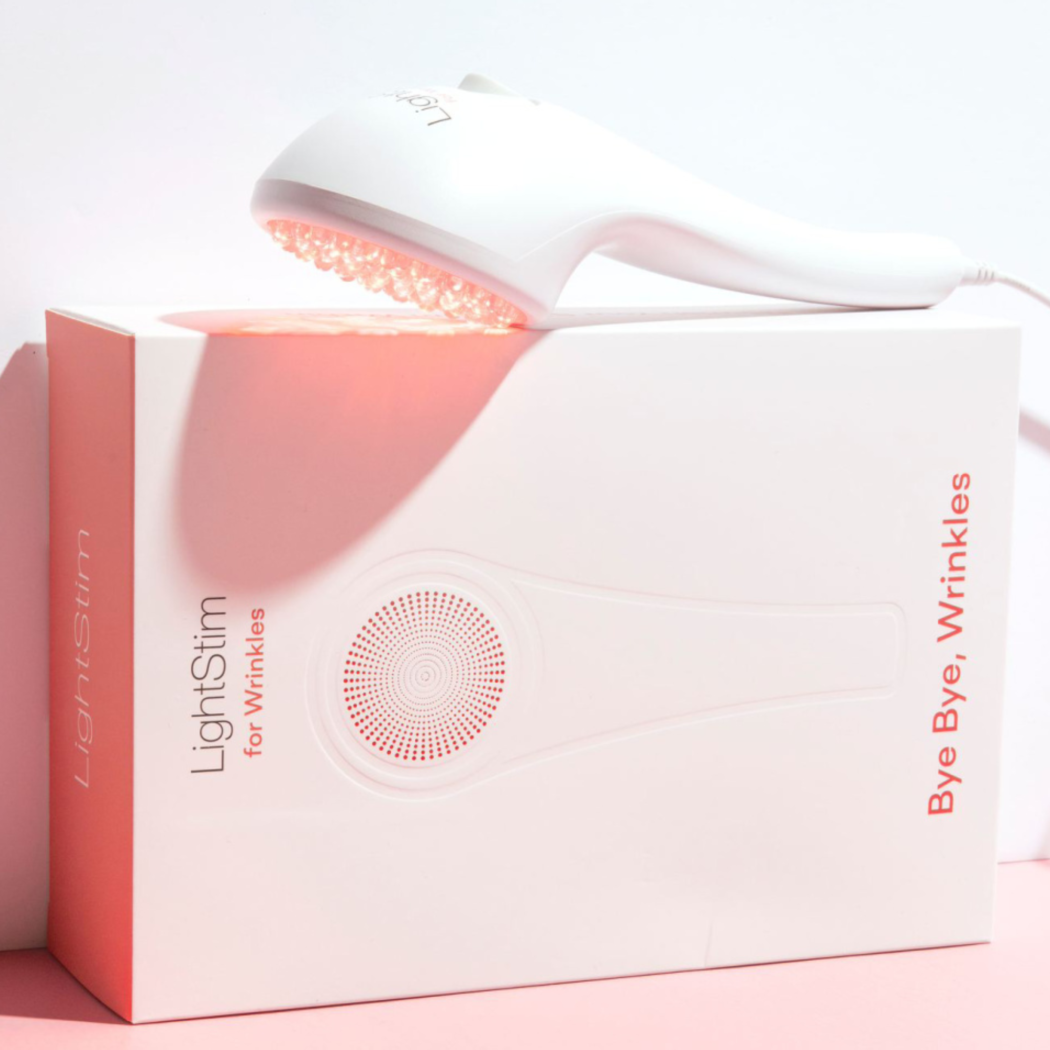 LightSlim device with packaging on a pink background