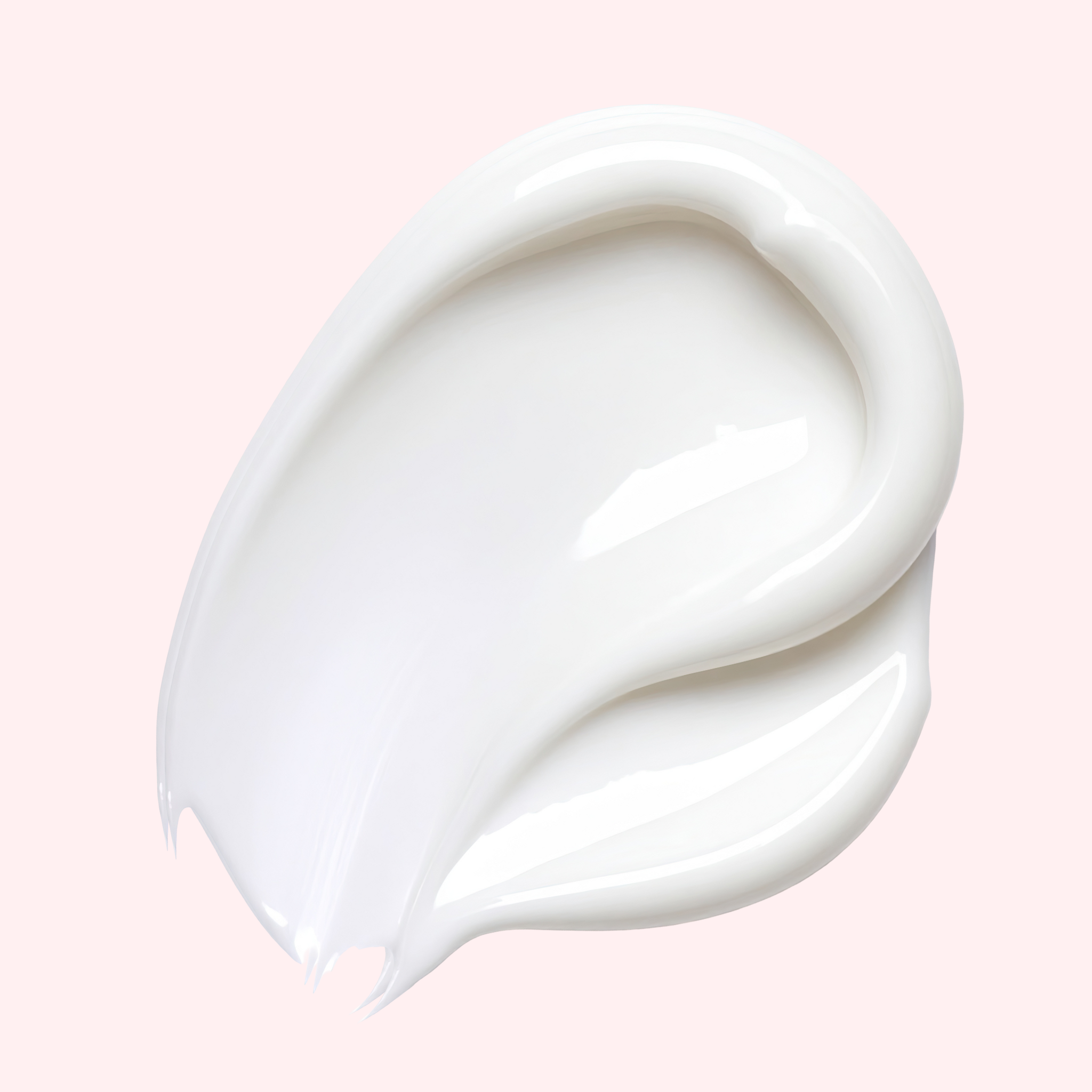 White cream or lotion swatch on a pink background