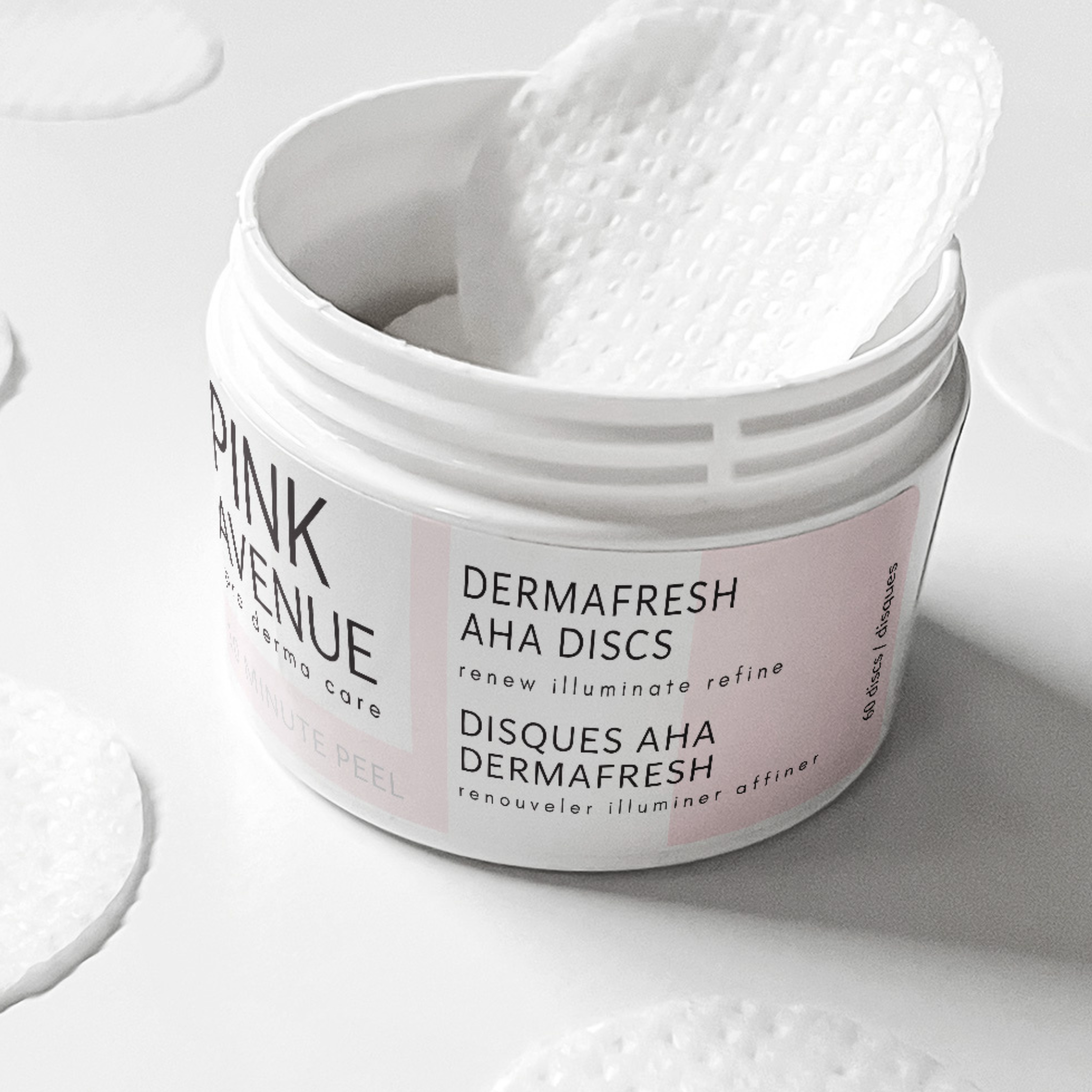 Pink Avenue Dermafresh AHA discs in a white container on a light background