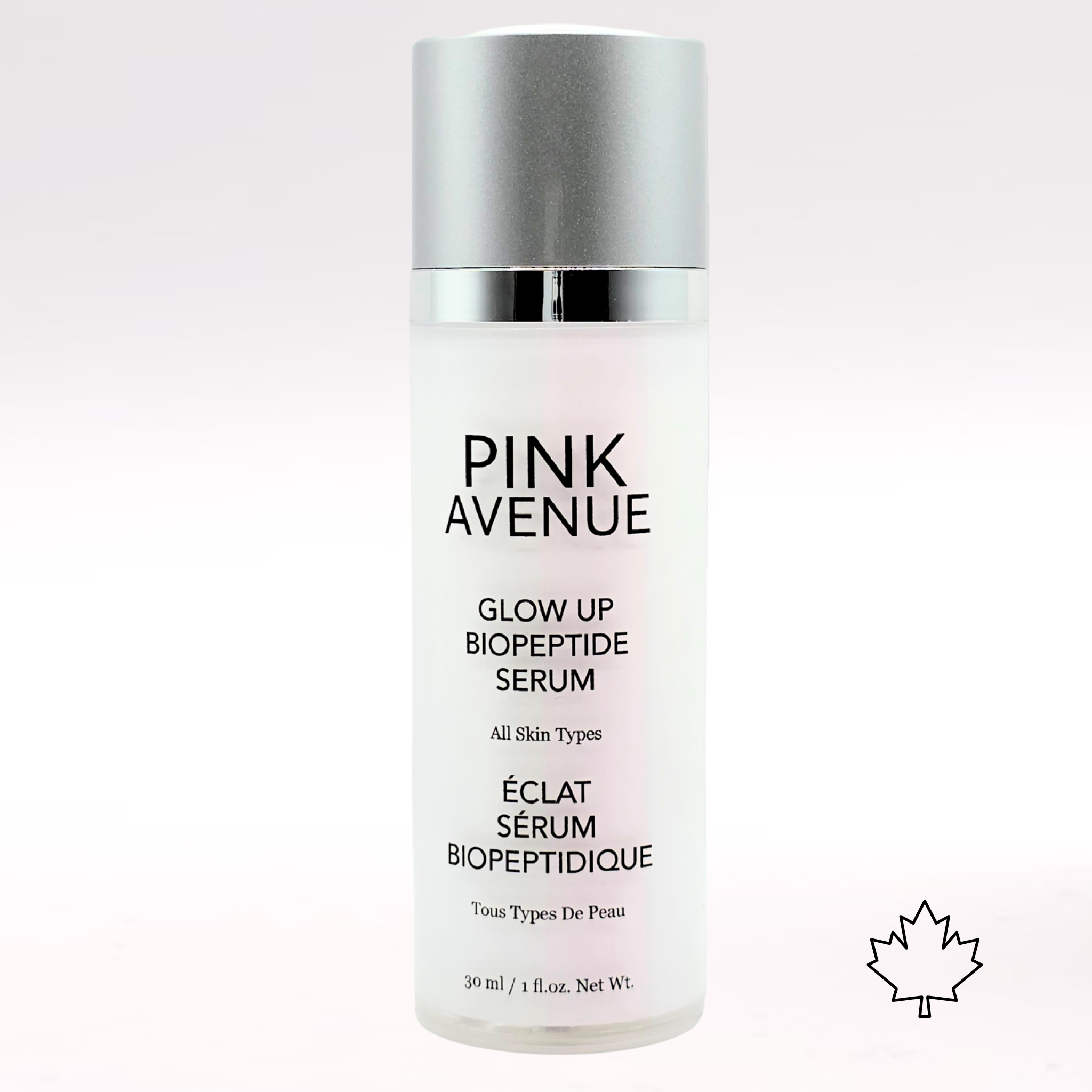 Pink Avenue Glow Up Biopeptide Serum bottle on a light pink background