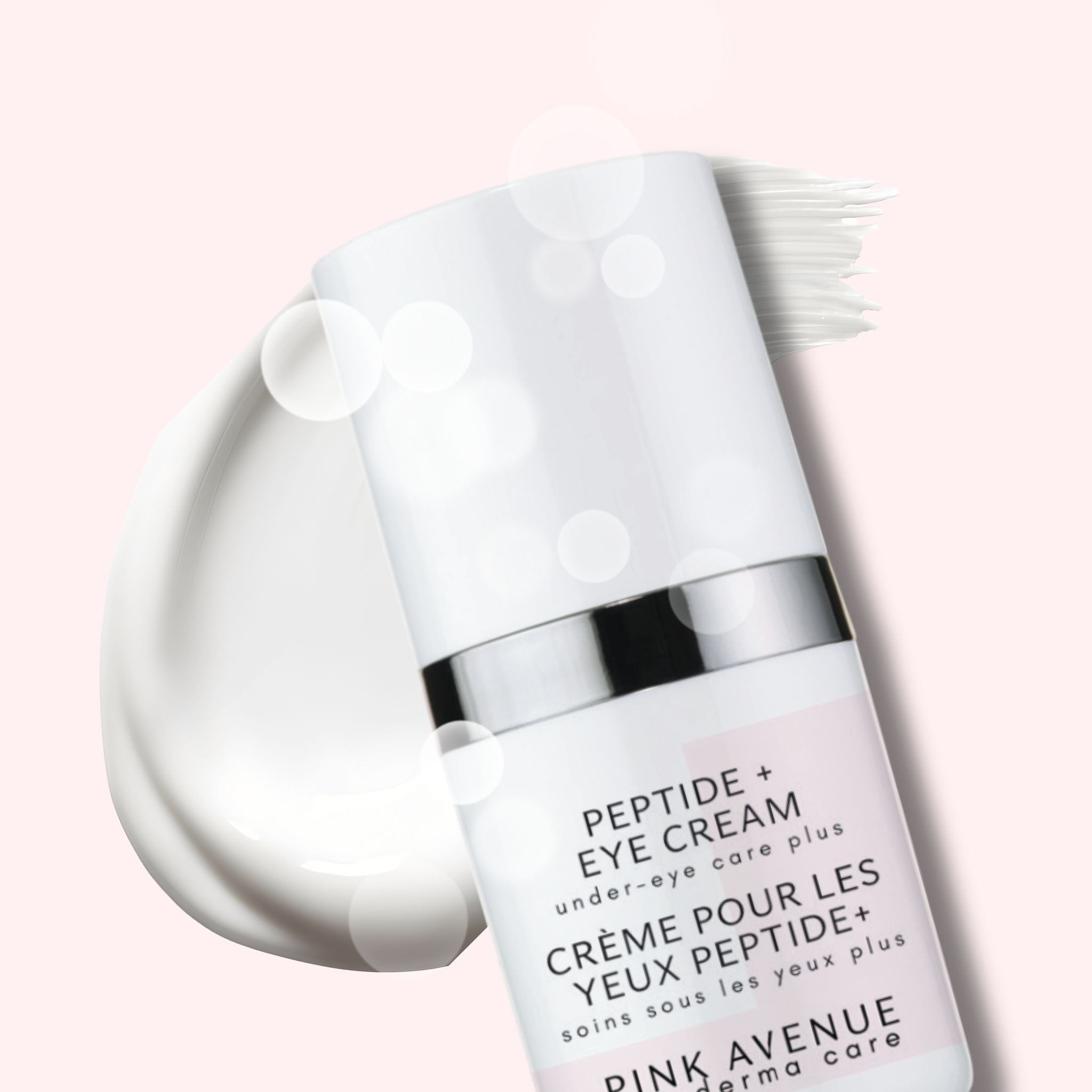 Peptide eye cream bottle with applicator on a light pink background
