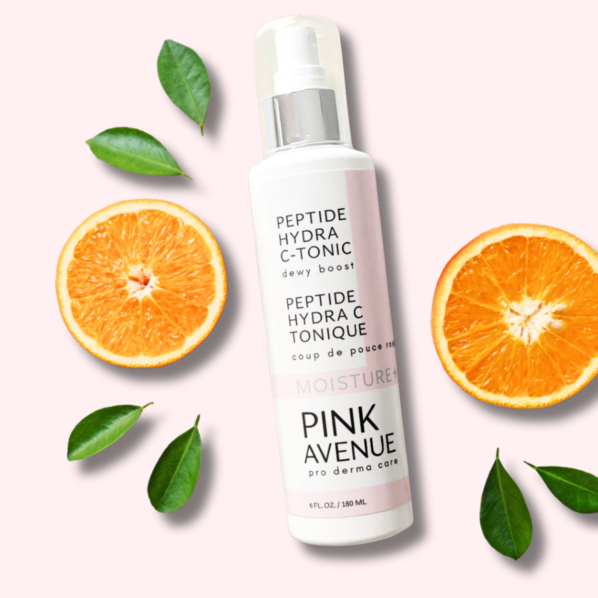 Pink Avenue Peptide Hydra C Tonic, flat lay with orange slices