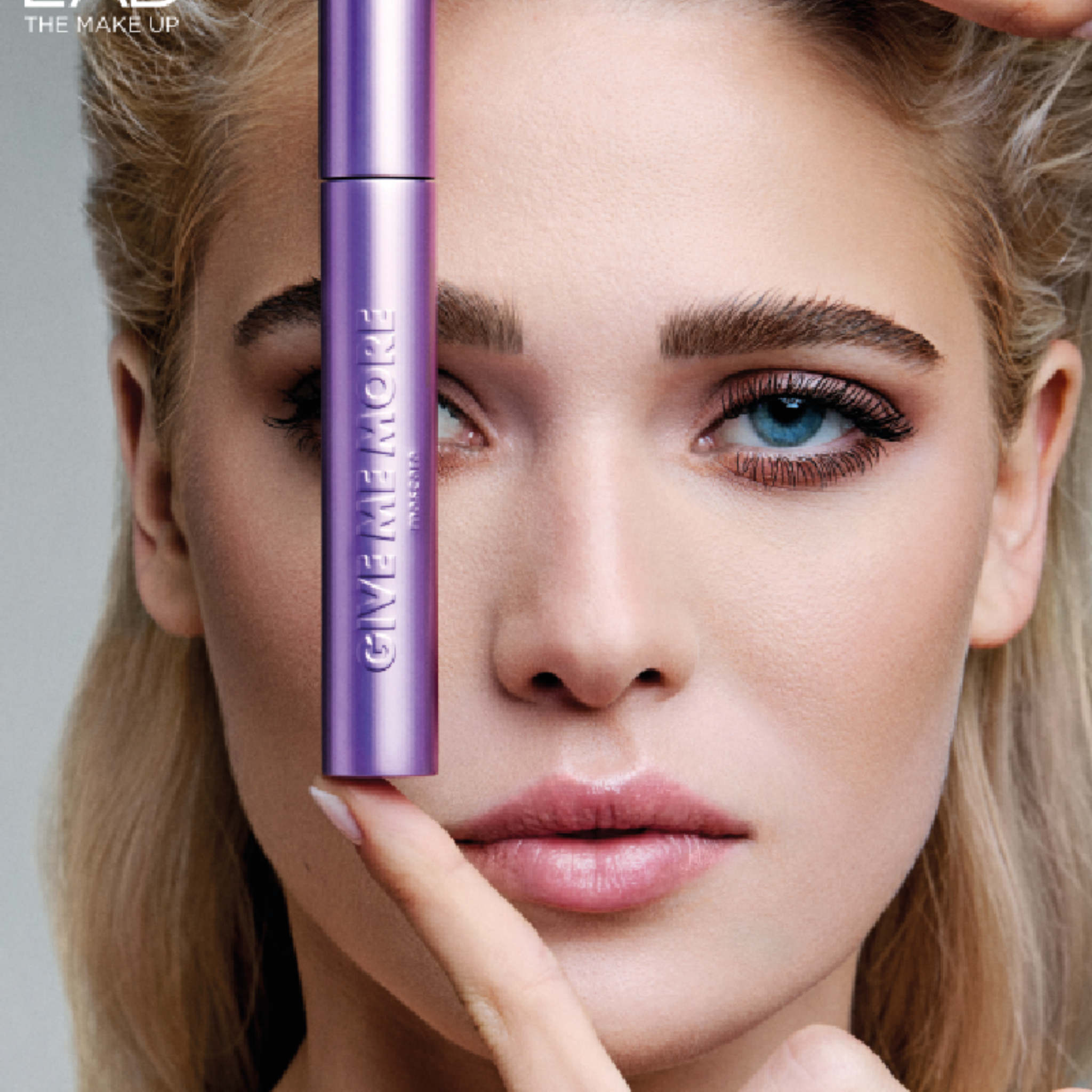 Model holding Give Me More Mascara