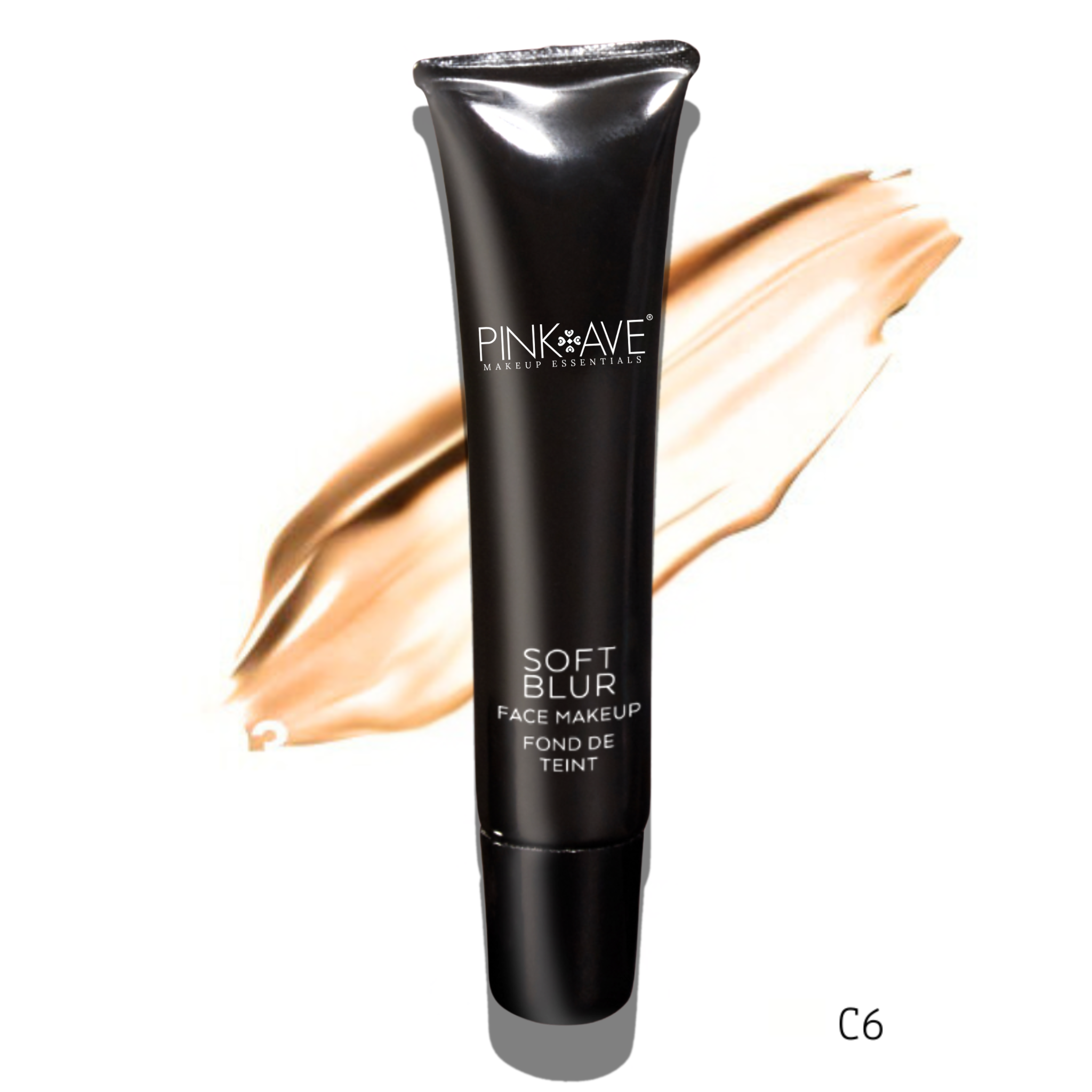 Black makeup tube labeled 'Pink Ave' with a swatch of foundation on a white background