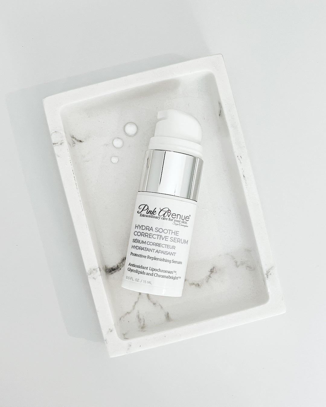 Pink Avenue Hydra Soothe Corrective Serum , Travel size placed in a marble box, Toronto,  Canada 