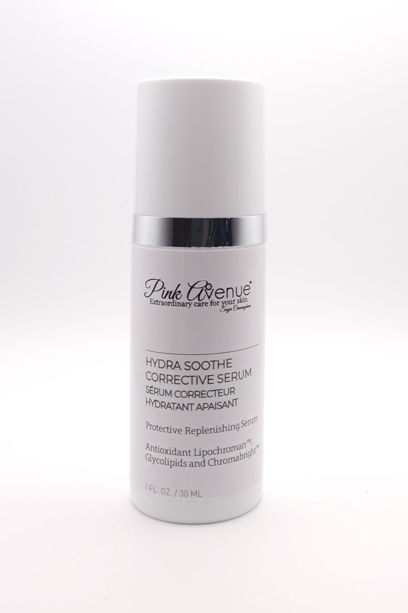 Pink Avenue Hydra Soothe Corrective Serum bottle with white pump dispenser and silver accent band, featuring protective replenishing serum with antioxidant lipochroman, glycolipids and chromabright, 1 FL OZ / 30 ML