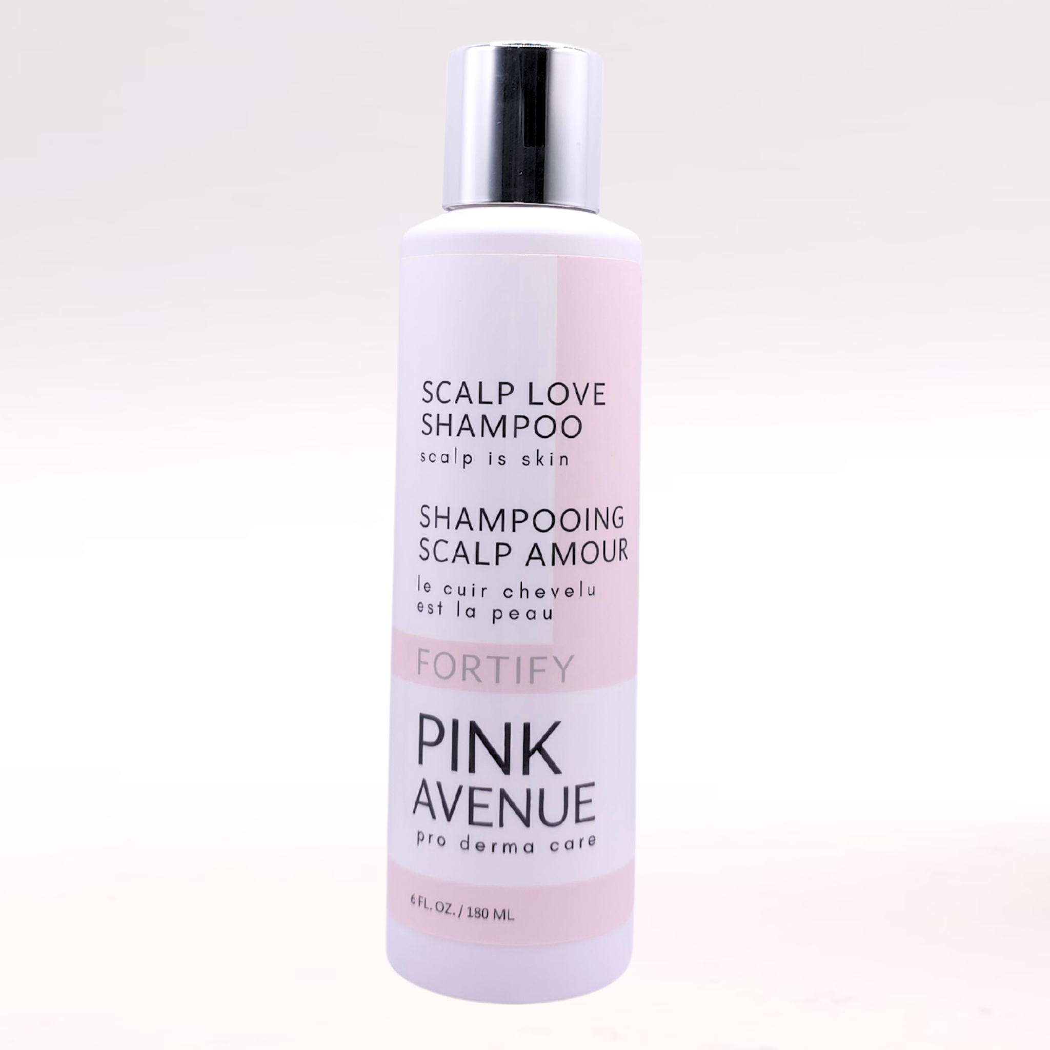 Bottle of Pink Avenue Scalp Love Shampoo on a white background