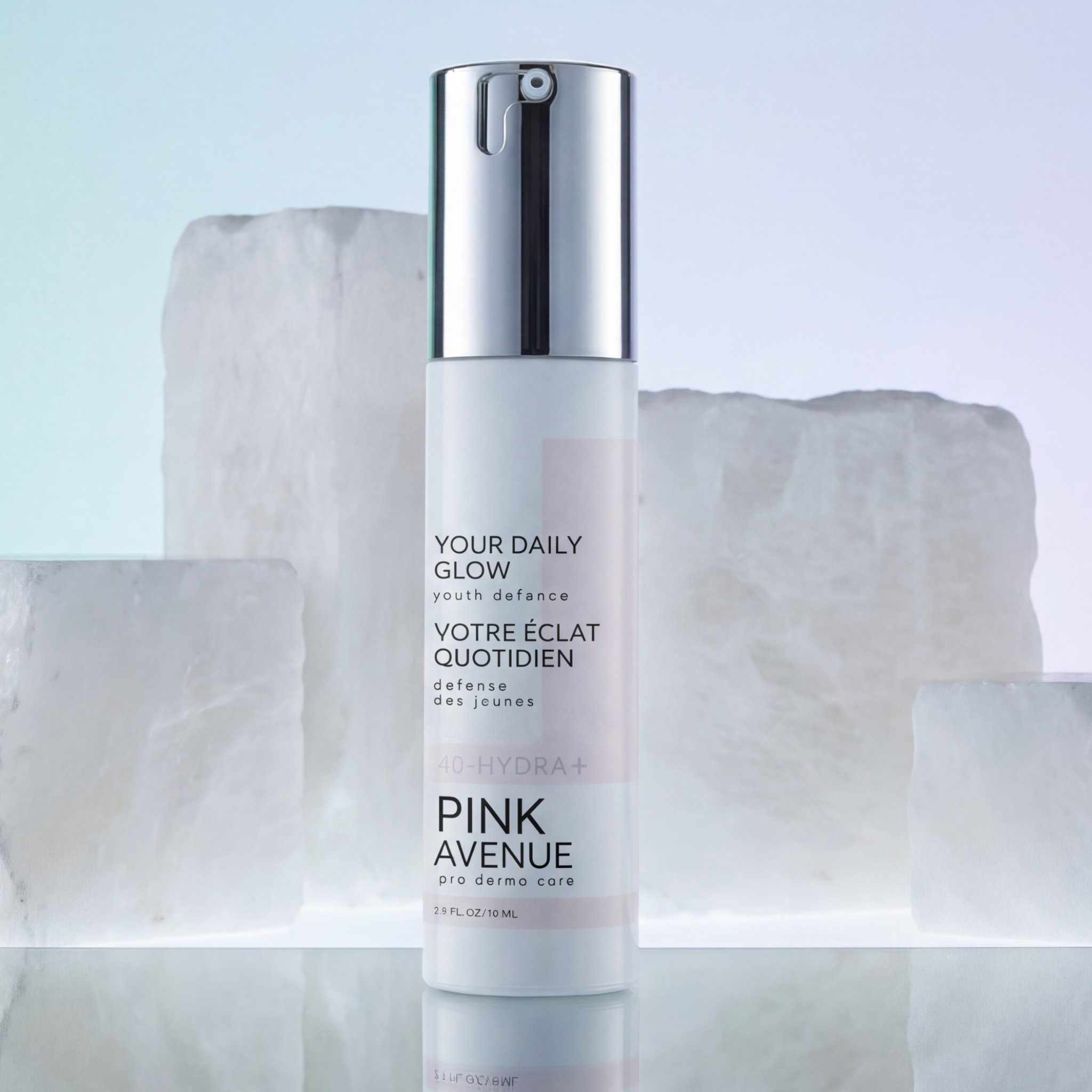 Skincare bottle labeled 'Pink Avenue' on a light blue background