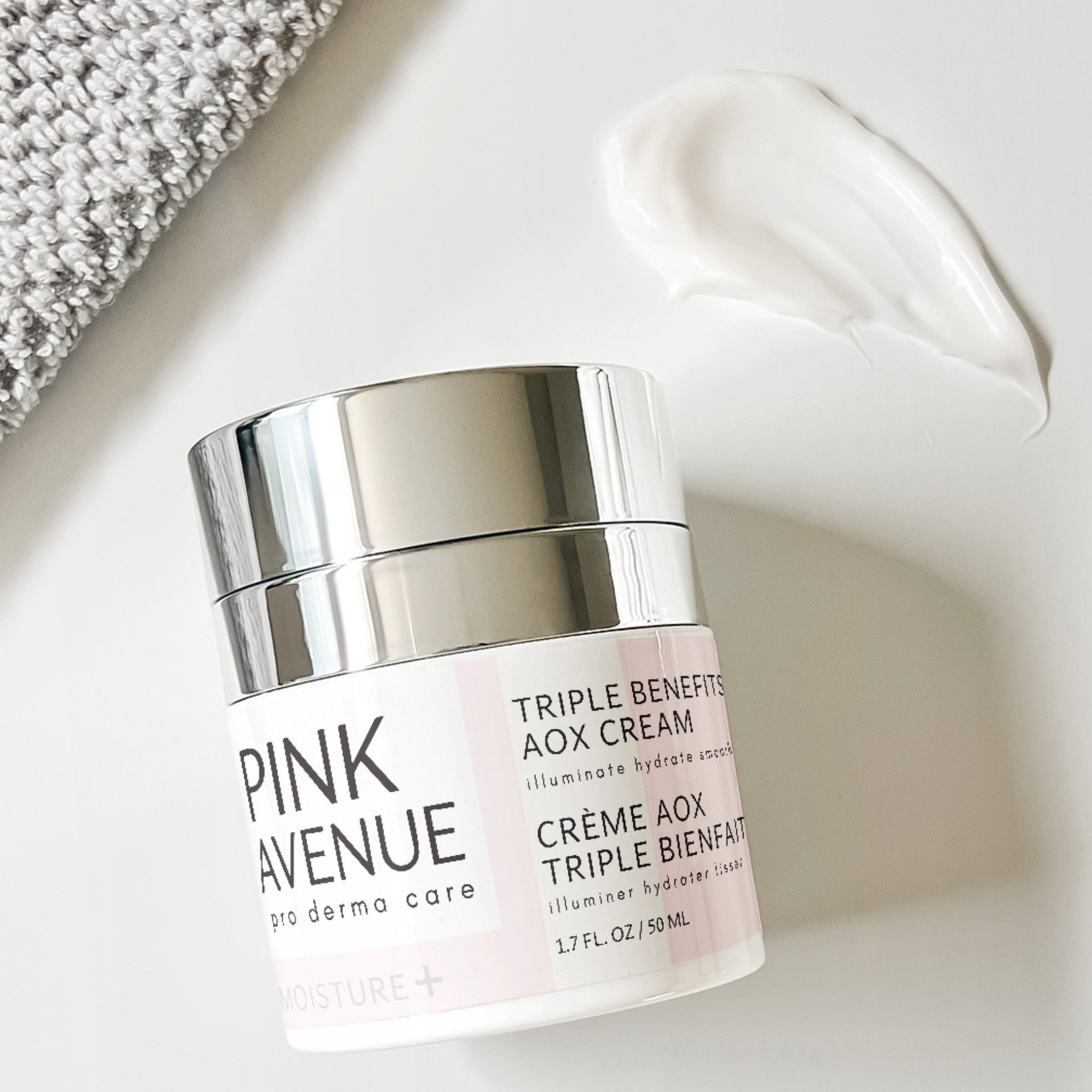 Pink Avenue Triple Benefits cream jar with silver lid on a white background