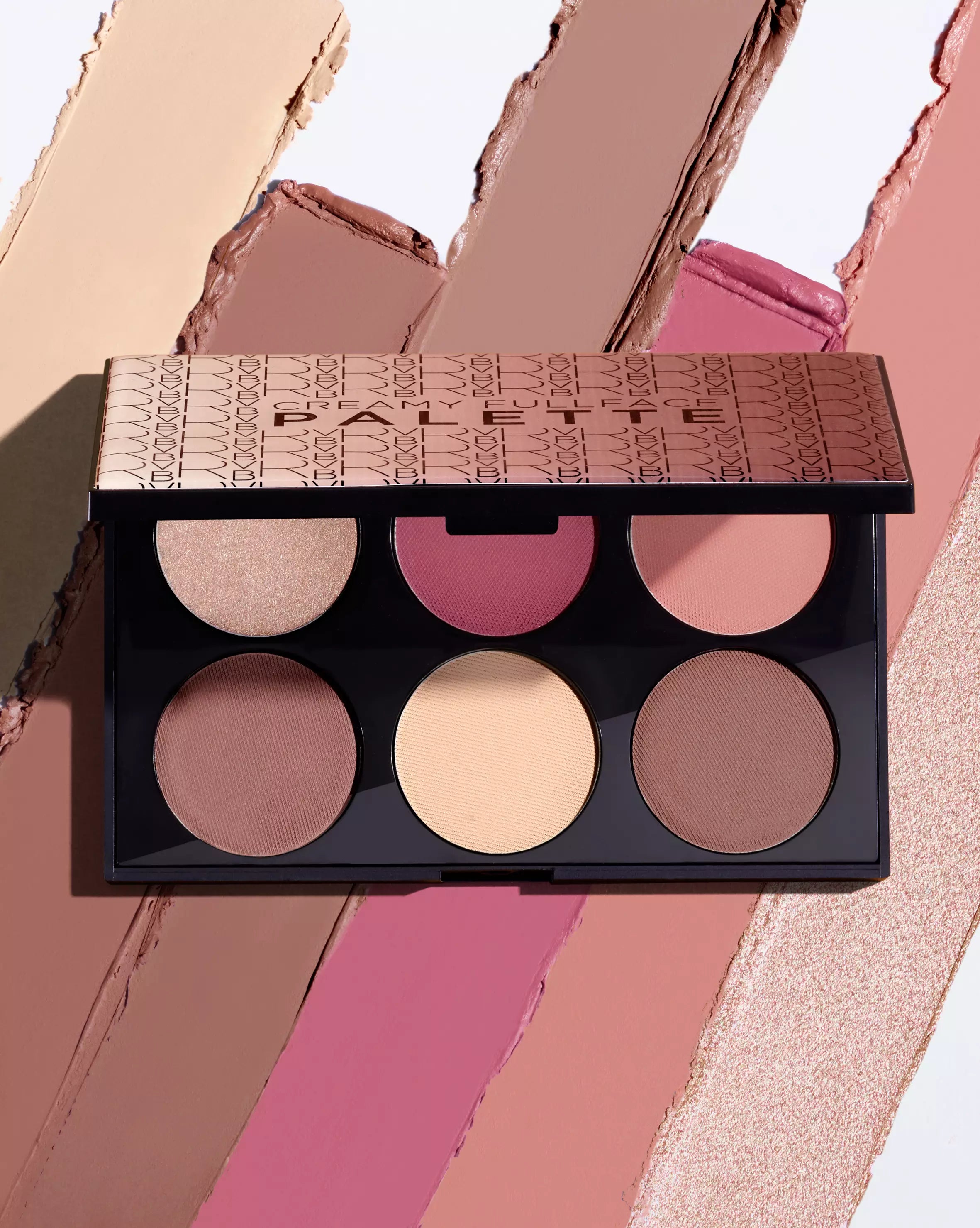 Makeup palette with various shades on a colorful background